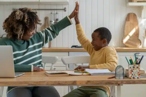 homeschool mom giving five to her son