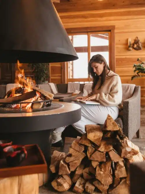 gift ideas for moms - mom reading by fire